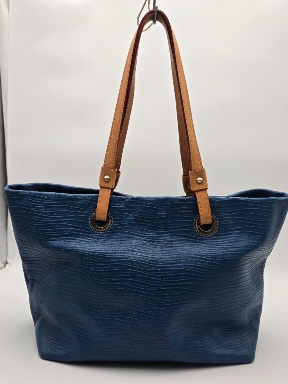 Dooney & Bourke Wavy Embossed Leather Grommet Shopper Tote Bag in Blue